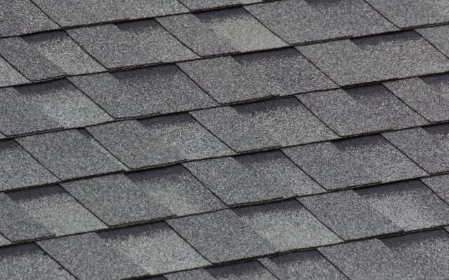 Close view of gray asphalt shingles on a Fayetteville Roofing Co roof
